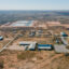 Circle 6 Baptist Camp, bottom, and produced water ponds, constructed by Martin Water, top, in Lenorah on Feb. 24, 2024. The Railroad Commission approved the construction of the ponds, used to treat and recycle produced water from fracking, next to the Circle 6 Baptist Camp in the Permian Basin. Credit: Julian Mancha for The Texas Tribune/Inside Climate News