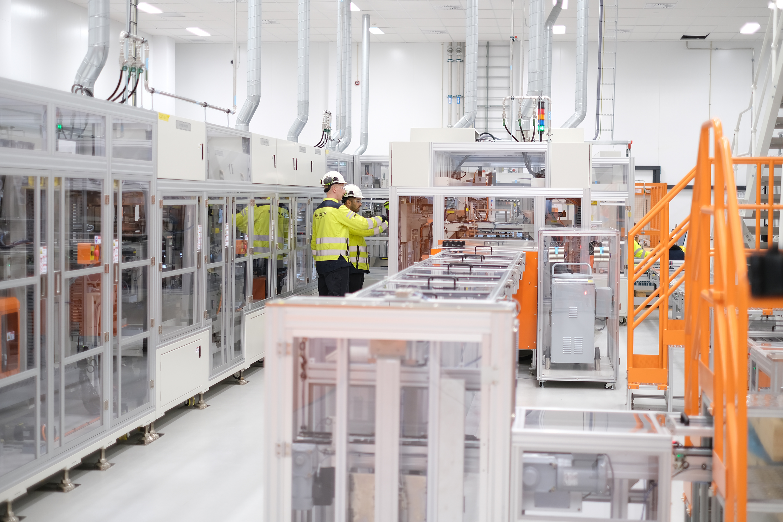 Workers view an assembly process at Freyr Battery's technology and development center in Mo i Rana, Norway. Credit: Phillip Navin/Freyr Battery