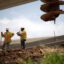 Construction workers rebuild the I-69 Southwest/I-610 West Loop Interchange during a heat wave in Houston, Texas, on July 14, 2023. Credit: Mark Felix/AFP via Getty Images