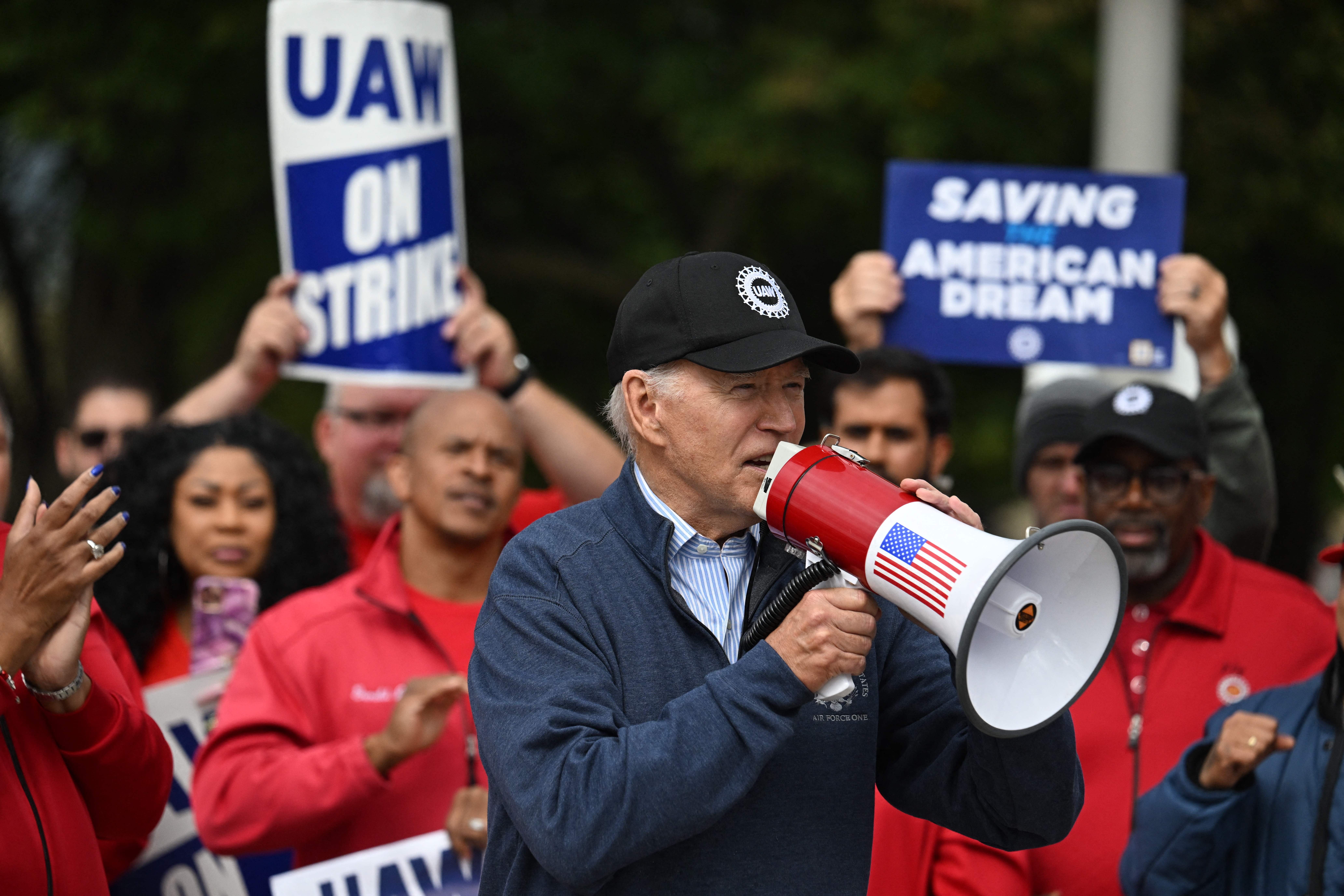 President Joe Biden addresses striking members of the United Auto Workers union at a picket line outside a General Motors Service Parts Operations plant in Belleville, Michigan, in September. Credit: Jim Watson/AFP via Getty Images