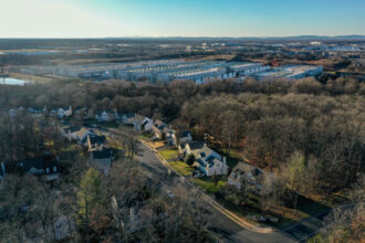 Amazon Web Services data centers are seen next to the Great Oak neighborhood on Jan. 24, 2023, in Manassas, Virginia. Credit: Jahi Chikwendiu/The Washington Post via Getty Images