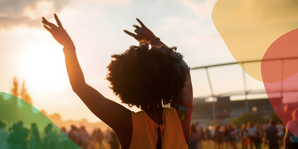 Woman with hands raised celebrating